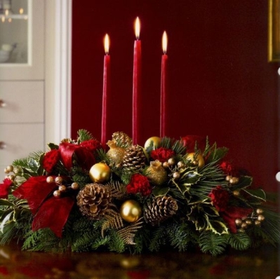 traditional red and gold table decoration with candles